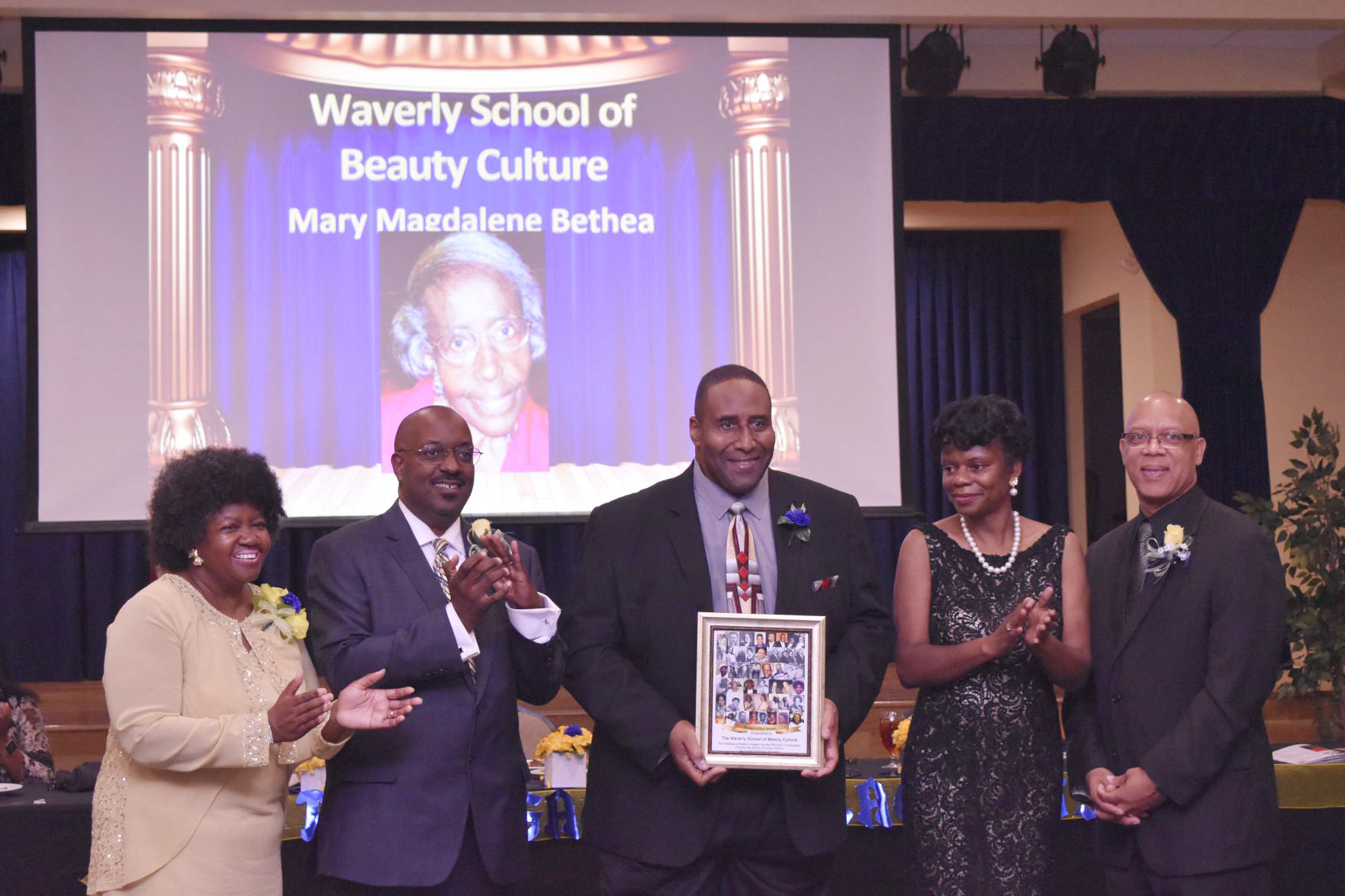 Moses Bethea, Jr. accepts Legacy Award for Waverly School of Beauty Culture.